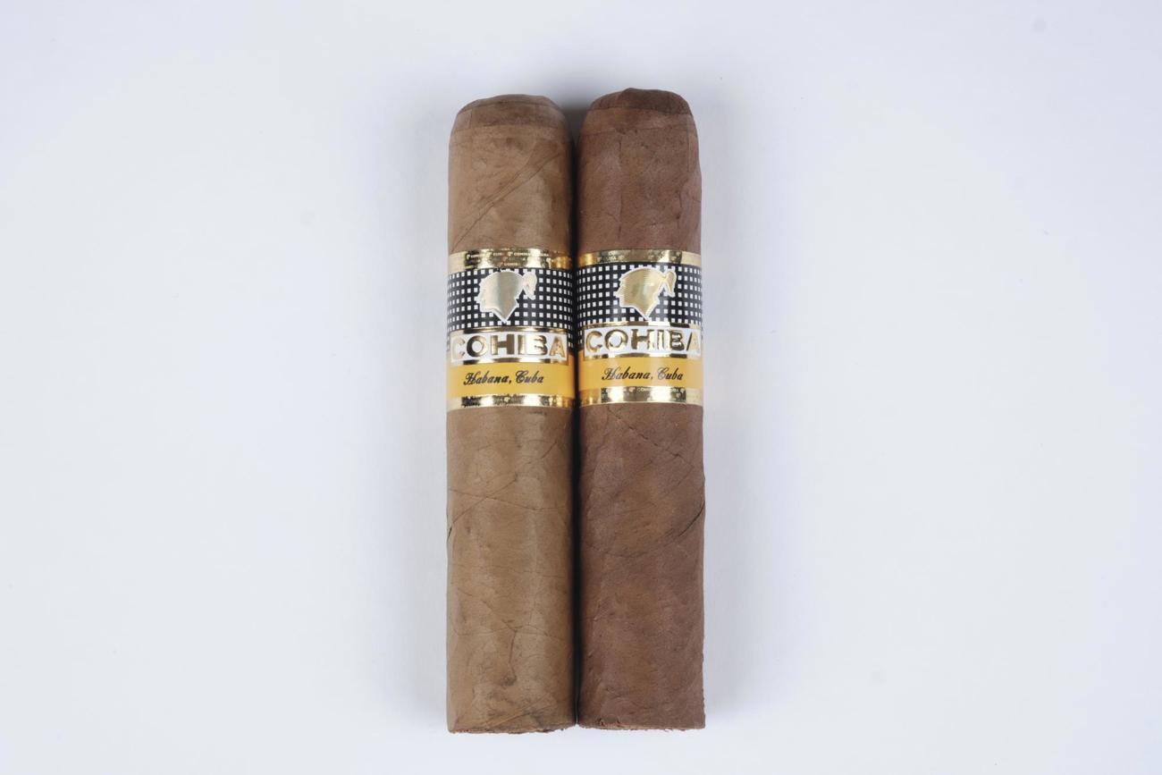 Bei der kopierten Cohiba Medio Siglo (links) fehlt das Relief im Schriftzug, zudem ist der Kopf nicht mittig gedruckt. Bei der kopierten Cohiba Medio Siglo (links) fehlt das Relief im Schriftzug, zudem ist der Kopf nicht mittig gedruckt.